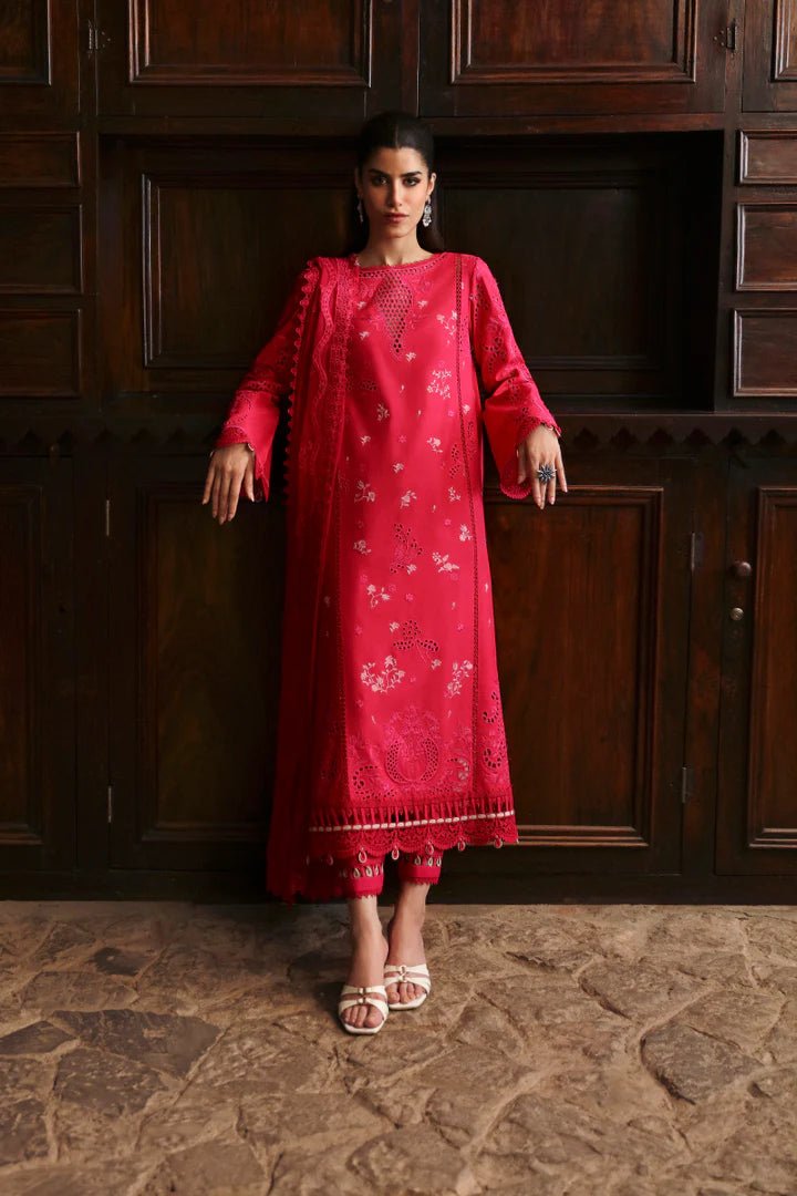 Model wearing LM - 07 NEESA dress from Qalamkar's Qlinekari Linen collection in vibrant red. Pakistani winter casual pret available online in the UK.