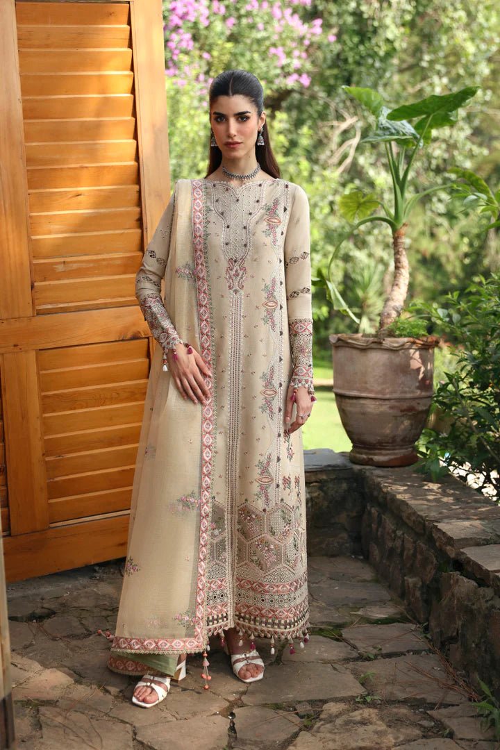 Model wearing LM - 11 ZIA dress from Qalamkar's Qlinekari Linen collection in beige. Pakistani winter casual pret available online in the UK.