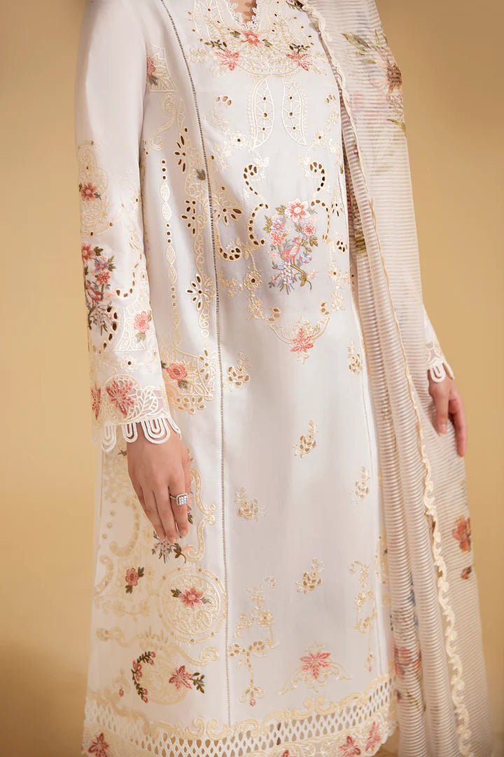 Model wearing cream SQ - 01 SARV dress from Qalamkar, featuring delicate floral embroidery and intricate lace detailing. Ideal for Pakistani designer clothes in the UK, readymade clothing, and luxurious lawn collections.