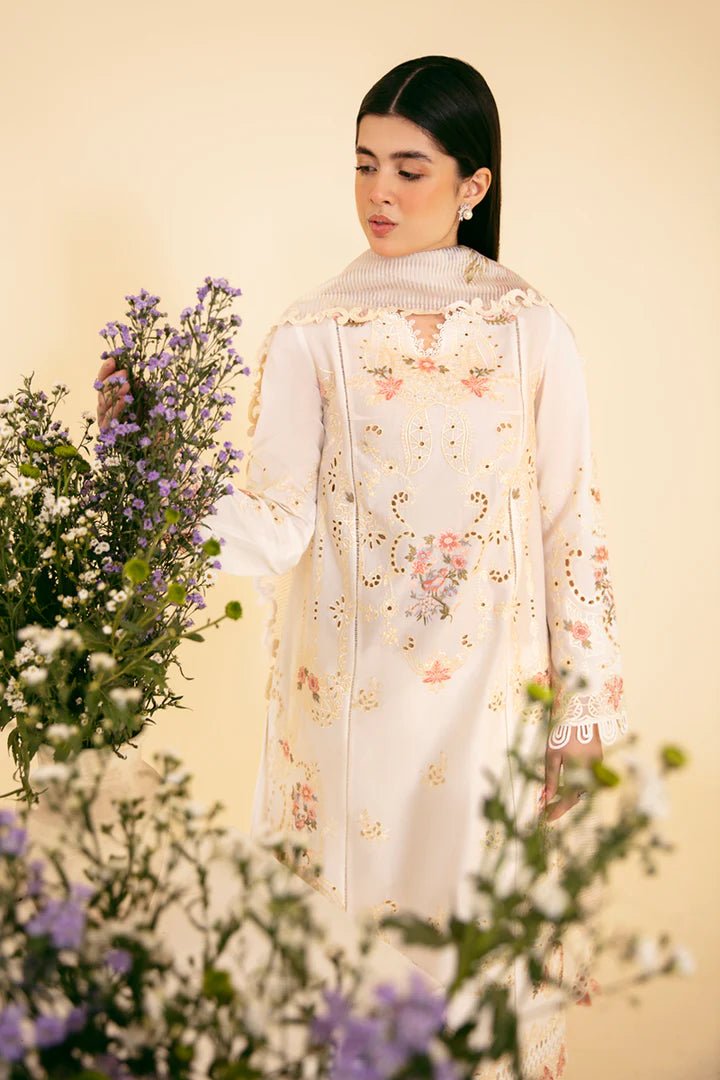 Model wearing cream SQ - 01 SARV dress from Qalamkar, featuring delicate floral embroidery and intricate lace detailing. Ideal for Pakistani designer clothes in the UK, readymade clothing, and luxurious lawn collections.