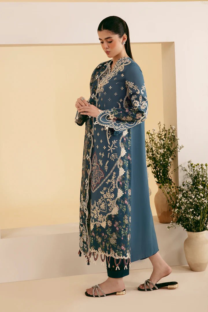 Model wearing blue SQ - 05 ELA dress from Qalamkar, featuring intricate embroidery and floral patterns. Ideal for Pakistani designer clothes in the UK, readymade clothing, and luxurious lawn collections.