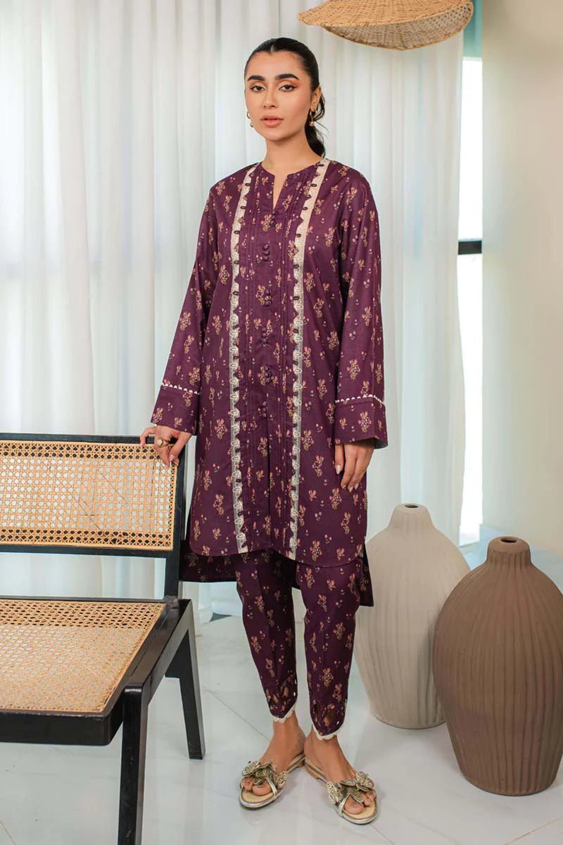 Model in Qalamkar DP - 02 LENA, a plum Pakistani outfit, with UK's latest fashion trend.