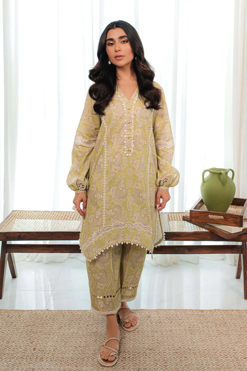 Model in Qalamkar DP - 03 MARGOT, olive Pakistani suit, for stylish UK wear.