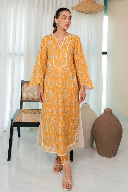 Model in Qalamkar DP - 05 MAELYS, an elegant mustard Pakistani dress, popular in UK fashion.