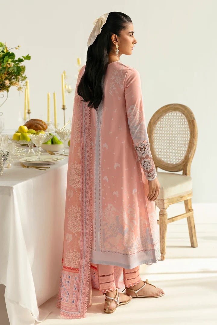 Model wearing peach PQ - 02 Aroha dress from Qalamkar, a stylish Pakistani lawn suit perfect for summer clothes in the UK.