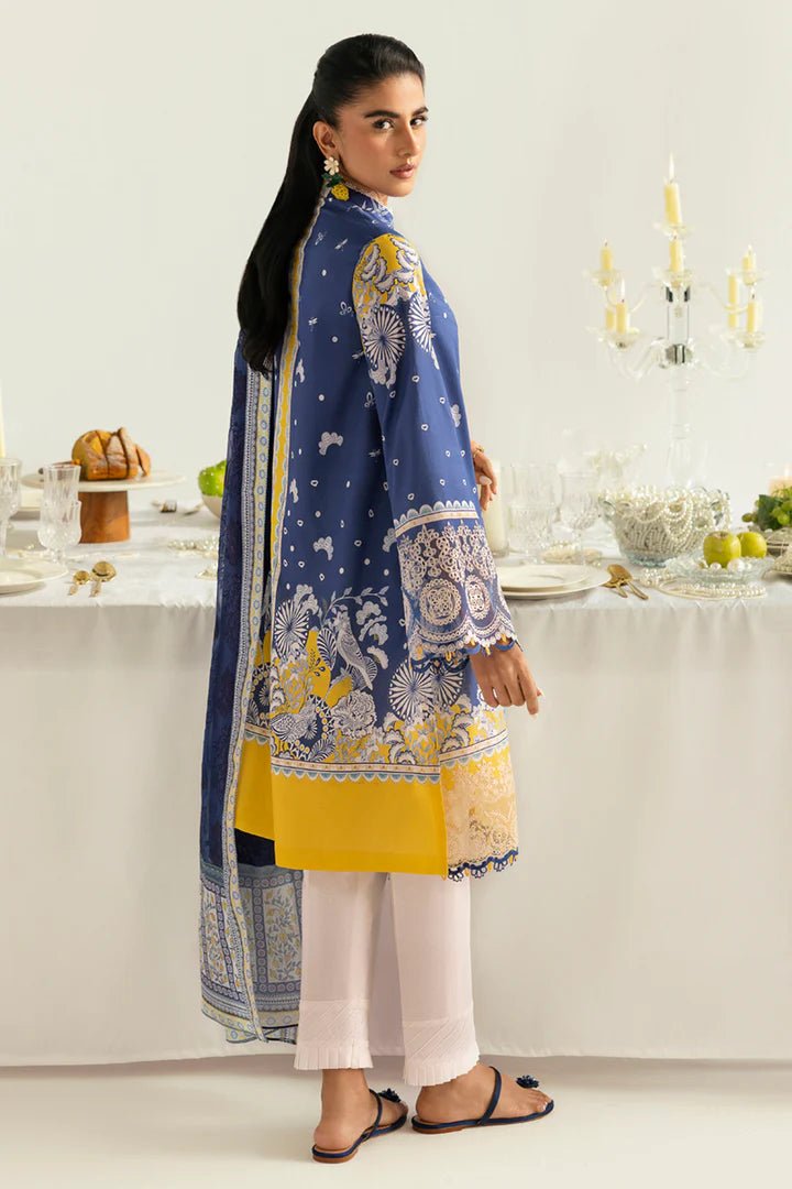 Model wearing blue and yellow PQ - 02 Hina dress from Qalamkar, a stylish Pakistani lawn suit perfect for eid and summer clothes in the UK.