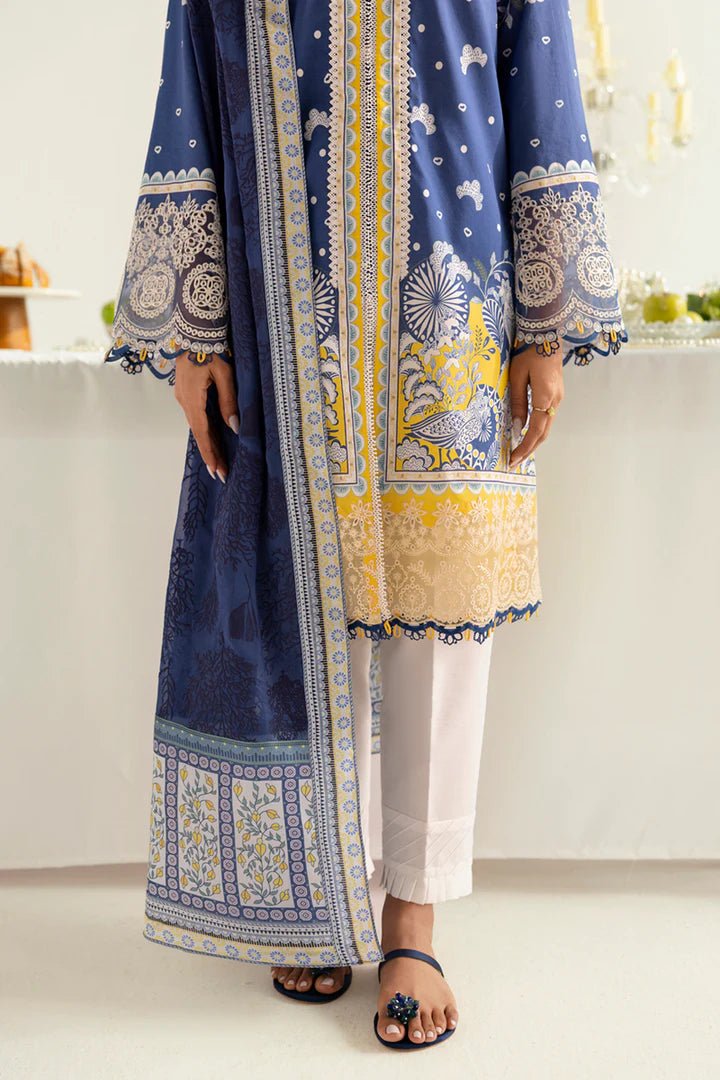 Model wearing blue and yellow PQ - 02 Hina dress from Qalamkar, a stylish Pakistani lawn suit perfect for eid and summer clothes in the UK.