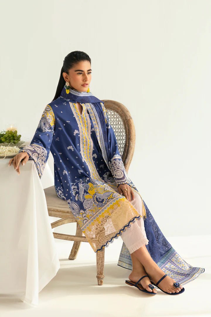 Model wearing blue and yellow PQ - 02 Hina dress from Qalamkar, a stylish Pakistani lawn suit perfect for eid and summer clothes in the UK.