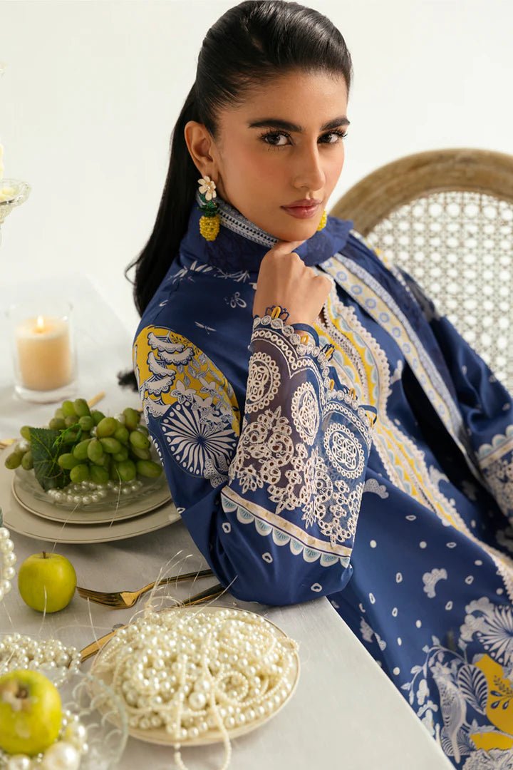 Model wearing blue and yellow PQ - 02 Hina dress from Qalamkar, a stylish Pakistani lawn suit perfect for eid and summer clothes in the UK.