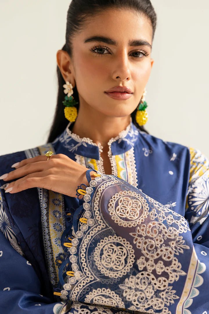 Model wearing blue and yellow PQ - 02 Hina dress from Qalamkar, a stylish Pakistani lawn suit perfect for eid and summer clothes in the UK.