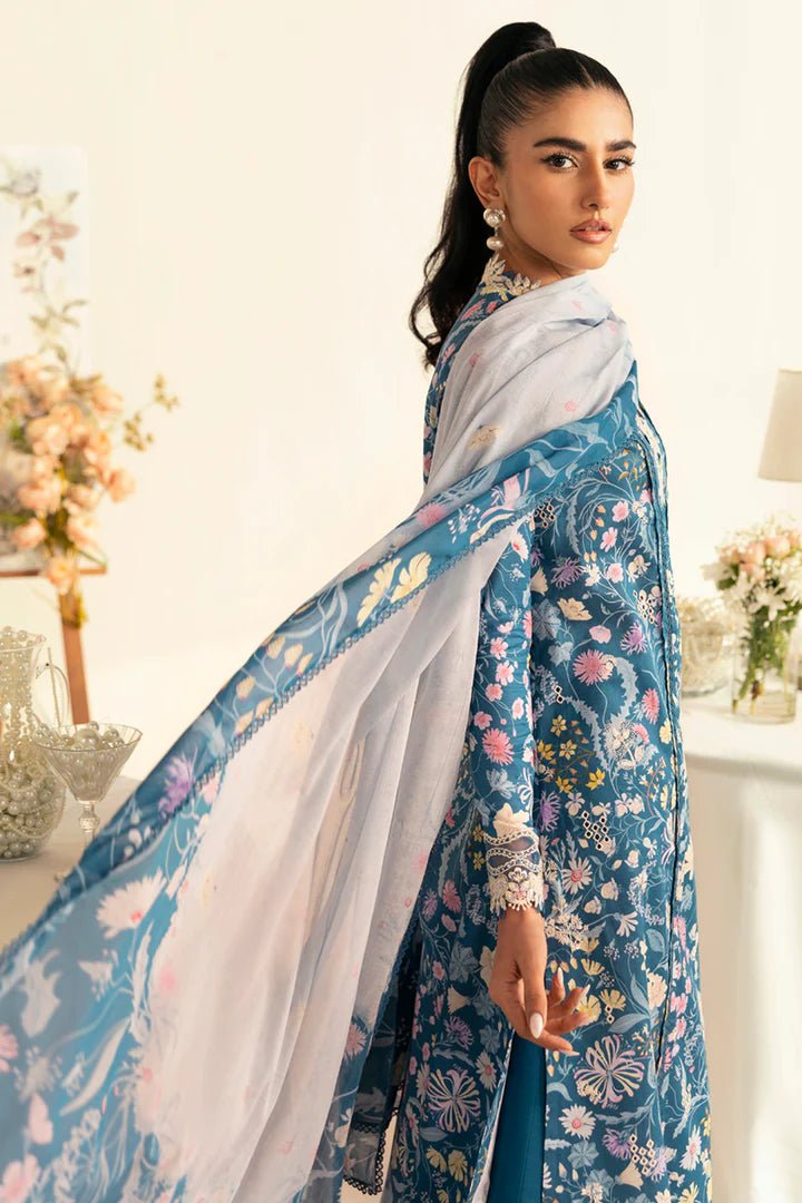 Model wearing teal PQ - 04 Rhea dress from Qalamkar, a stylish Pakistani lawn suit perfect for summer clothes in the UK.