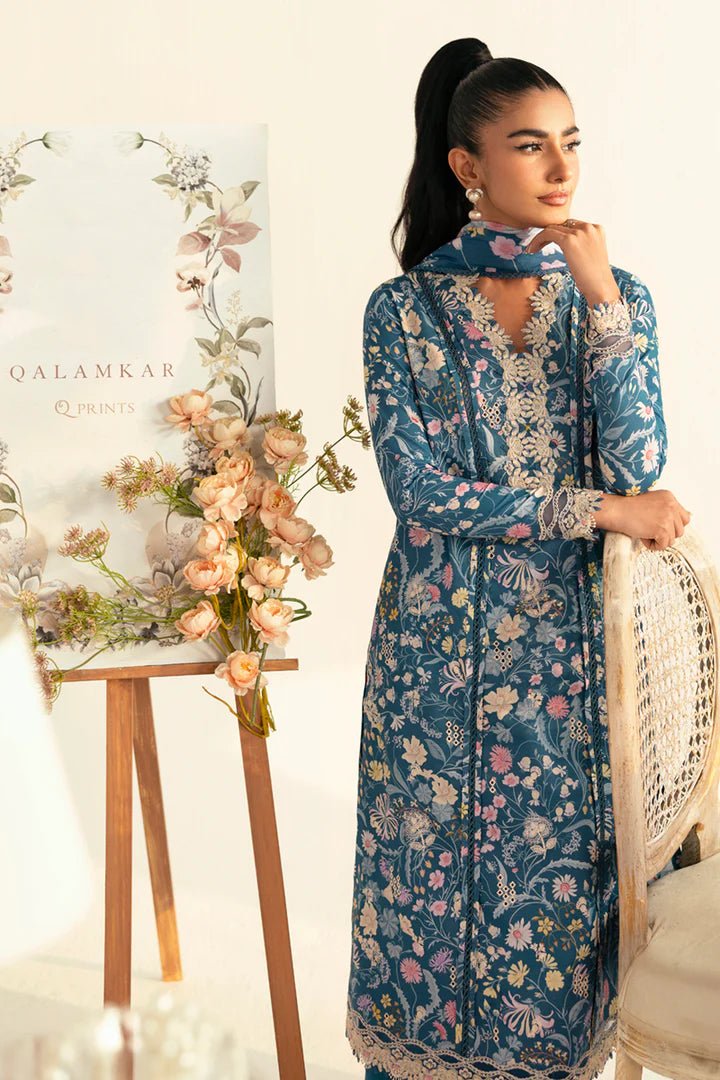 Model wearing teal PQ - 04 Rhea dress from Qalamkar, a stylish Pakistani lawn suit perfect for summer clothes in the UK.