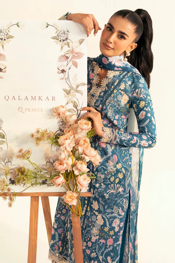 Model wearing teal PQ - 04 Rhea dress from Qalamkar, a stylish Pakistani lawn suit perfect for summer clothes in the UK.