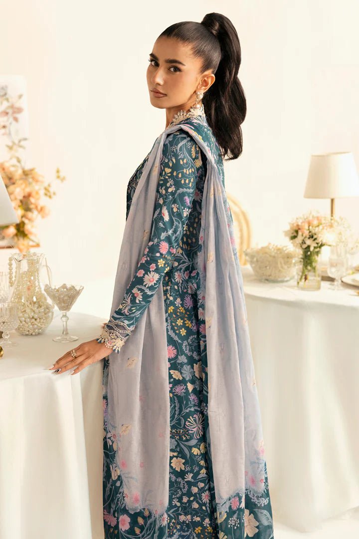 Model wearing teal PQ - 04 Rhea dress from Qalamkar, a stylish Pakistani lawn suit perfect for summer clothes in the UK.