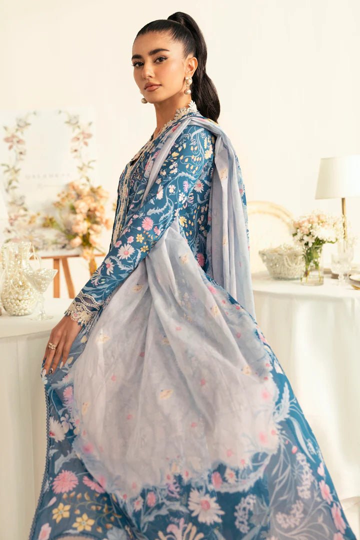 Model wearing teal PQ - 04 Rhea dress from Qalamkar, a stylish Pakistani lawn suit perfect for summer clothes in the UK.