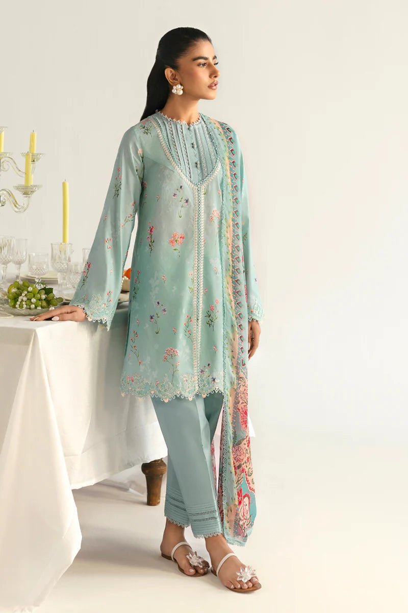 Model wearing Qalamkar Qprints '25 PQ - 08 Rena dress in pastel mint green with delicate floral embroidery. Shop Pakistani clothes online in the UK now.