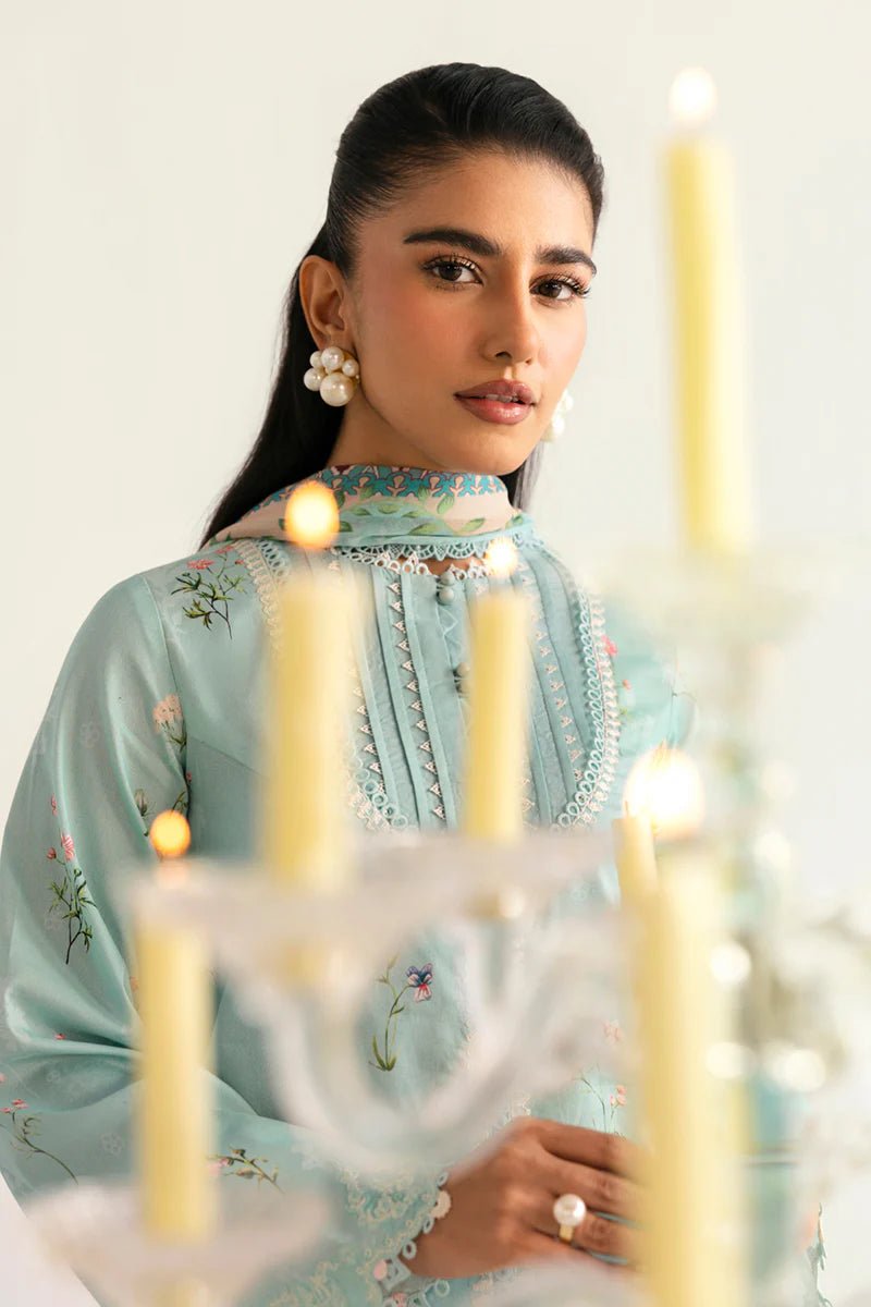 Model wearing Qalamkar Qprints '25 PQ - 08 Rena dress in pastel mint green with delicate floral embroidery. Shop Pakistani clothes online in the UK now.