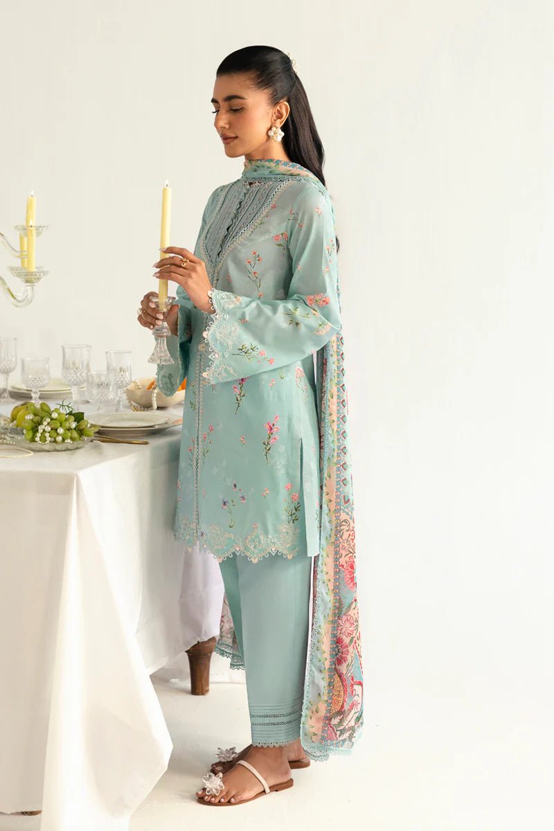 Model wearing Qalamkar Qprints '25 PQ - 08 Rena dress in pastel mint green with delicate floral embroidery. Shop Pakistani clothes online in the UK now.