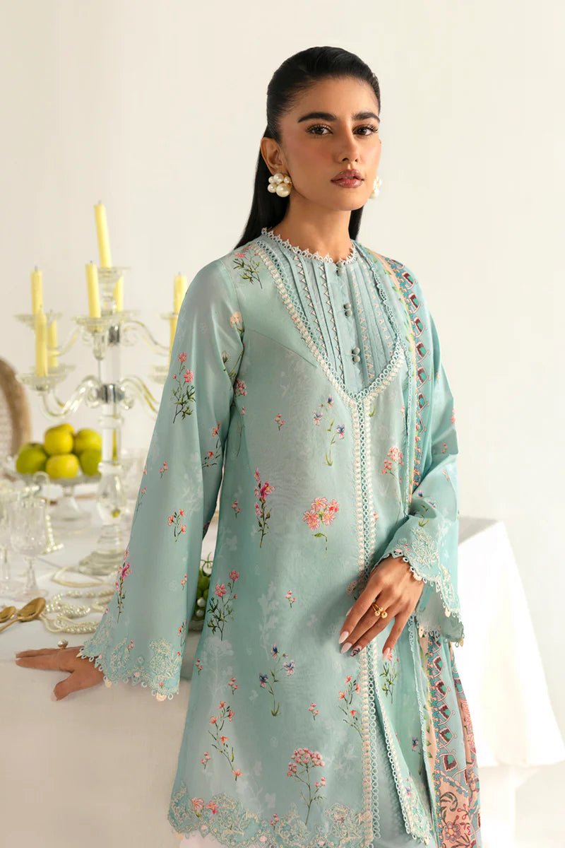 Model wearing Qalamkar Qprints '25 PQ - 08 Rena dress in pastel mint green with delicate floral embroidery. Shop Pakistani clothes online in the UK now.