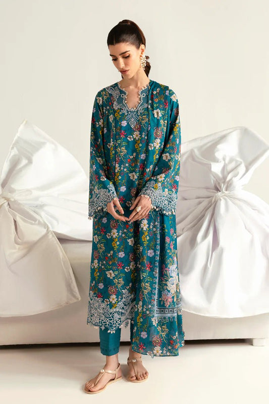 Model wearing Qalamkar Qprints '25 PQ - 10 Faha dress in teal with vibrant floral prints and lace detailing. Shop Pakistani clothes online in the UK now.