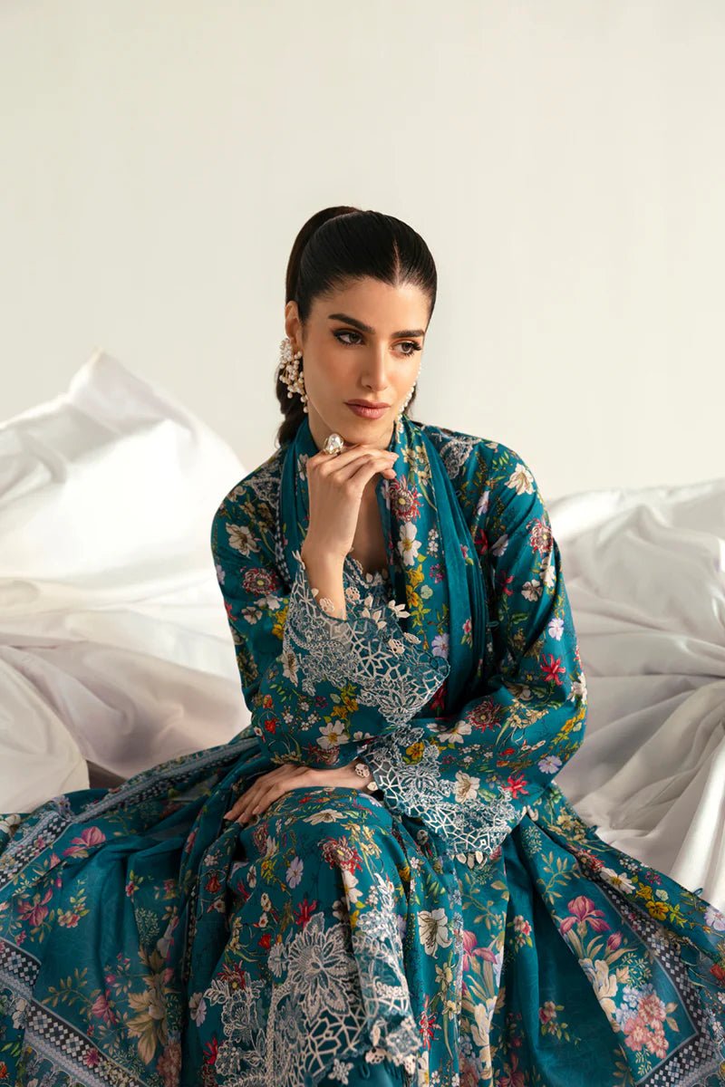 Model wearing Qalamkar Qprints '25 PQ - 10 Faha dress in teal with vibrant floral prints and lace detailing. Shop Pakistani clothes online in the UK now.