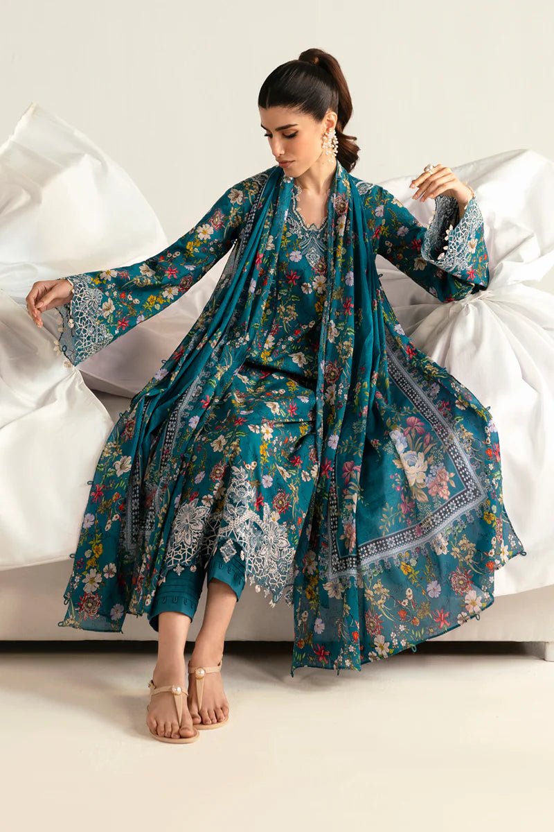 Model wearing Qalamkar Qprints '25 PQ - 10 Faha dress in teal with vibrant floral prints and lace detailing. Shop Pakistani clothes online in the UK now.