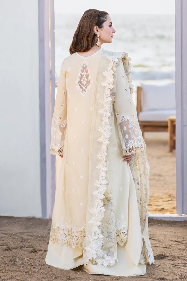 Model wearing cream FP - 01 JANA dress from Qalamkar's SAHIL KINARE Luxury Lawn ’24 collection. This image showcases Pakistani clothes online in the UK, ideal for lawn suits.