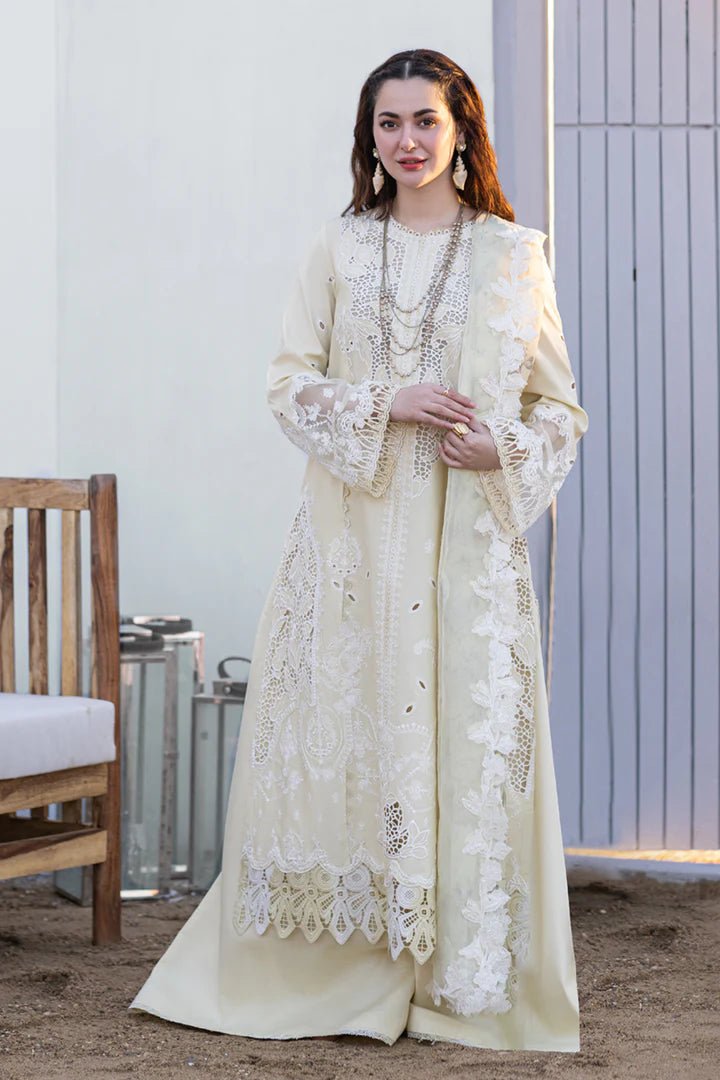 Model wearing cream FP - 01 JANA dress from Qalamkar's SAHIL KINARE Luxury Lawn ’24 collection. This image showcases Pakistani clothes online in the UK, ideal for lawn suits.