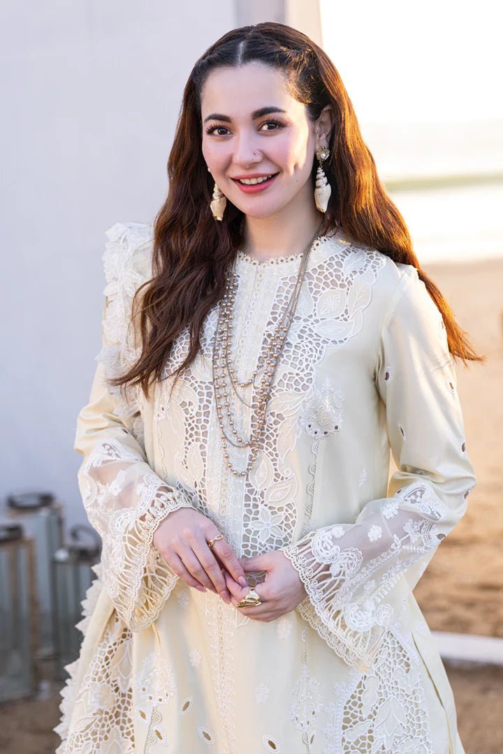 Model wearing cream FP - 01 JANA dress from Qalamkar's SAHIL KINARE Luxury Lawn ’24 collection. This image showcases Pakistani clothes online in the UK, ideal for lawn suits.