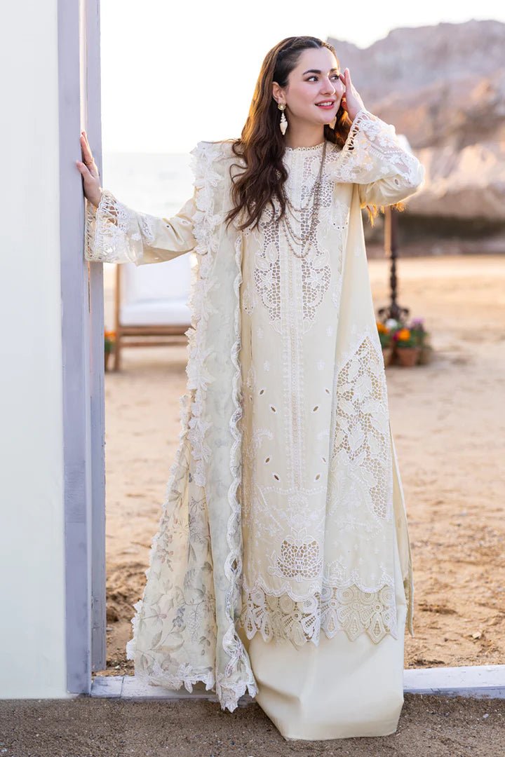 Model wearing cream FP - 01 JANA dress from Qalamkar's SAHIL KINARE Luxury Lawn ’24 collection. This image showcases Pakistani clothes online in the UK, ideal for lawn suits.