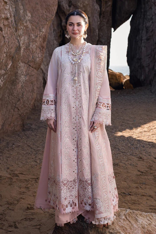 Model wearing a pale pink dress with intricate embroidery from Qalamkar's SAHIL KINARE - Luxury Lawn’24 collection, FP - 05 AALIYAH. Shop Qalamkar Pakistani clothes online in UK.