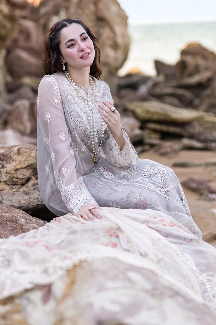 Model wearing Qalamkar's FP - 11 EMIRA dress in soft lavender with intricate embroidery, available in the UK. Ideal for luxury lawn suits and Pakistani clothes online.