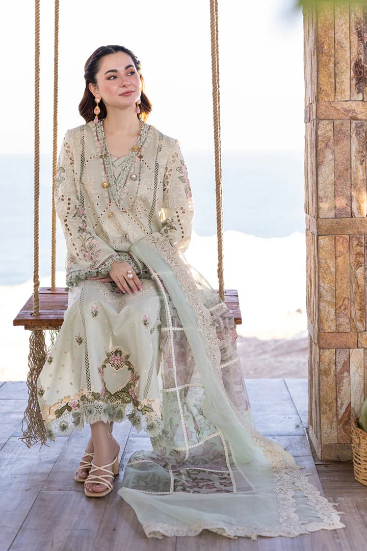 Model wearing pastel green lawn dress with floral embroidery and lace detailing from Qalamkar's SAHIL KINARE - Luxury Lawn’24 collection, FP - 15 RANIA. Perfect for showcasing Pakistani clothes online in UK