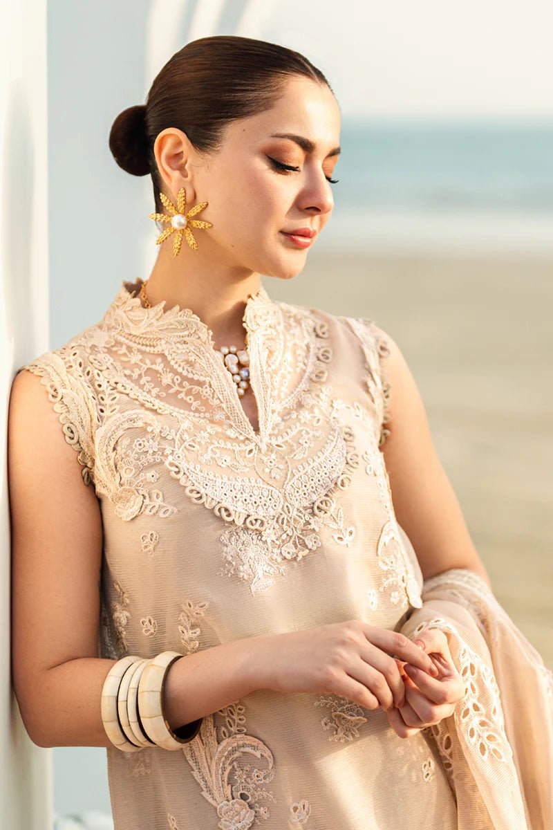 Model wearing Qalamkar Sahil Luxury Lawn '25 FK - 01 SOPHIA dress in soft beige with intricate embroidery. Shop Pakistani clothes online in the UK now.