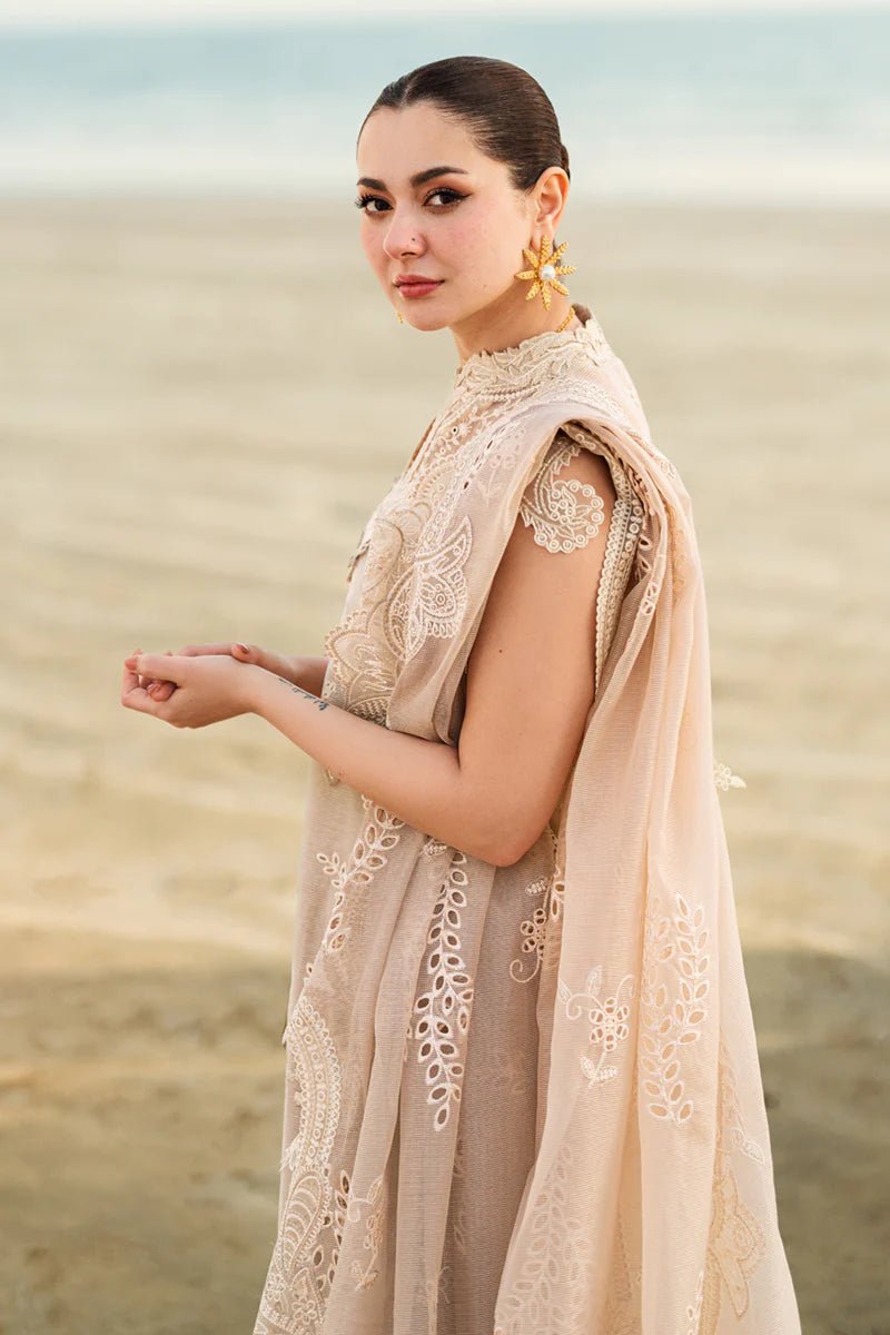 Model wearing Qalamkar Sahil Luxury Lawn '25 FK - 01 SOPHIA dress in soft beige with intricate embroidery. Shop Pakistani clothes online in the UK now.