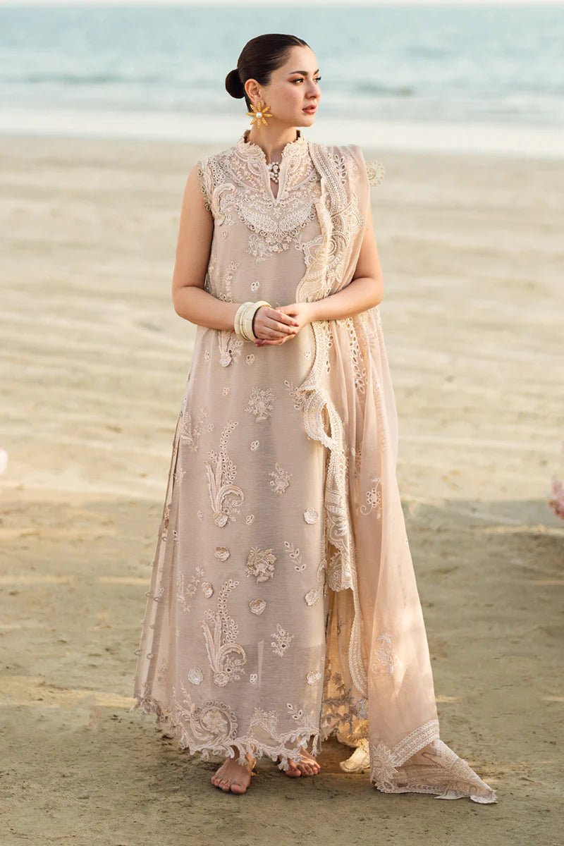 Model wearing Qalamkar Sahil Luxury Lawn '25 FK - 01 SOPHIA dress in soft beige with intricate embroidery. Shop Pakistani clothes online in the UK now.