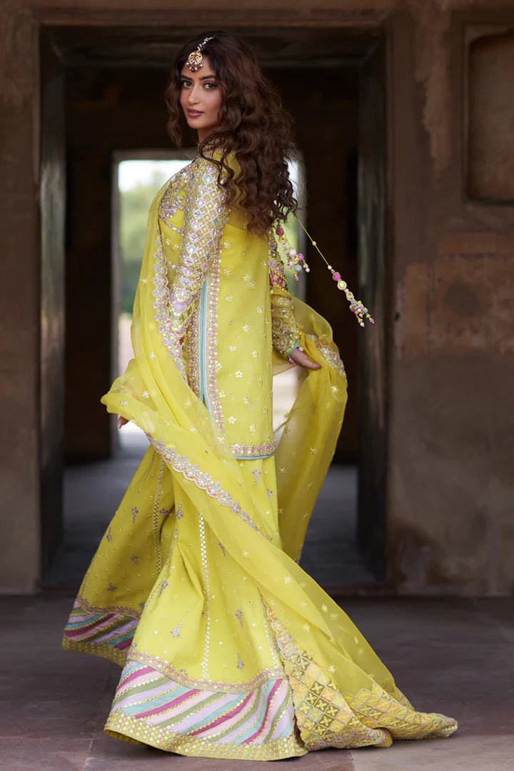 Model wearing yellow Dania SH - 05 dress from Qalamkar, featuring intricate embellishments and embroidery, perfect for Pakistani wedding clothes in the UK.