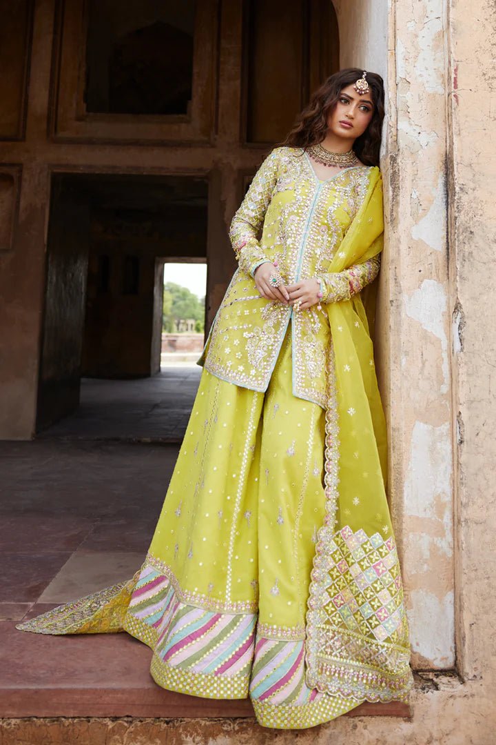 Model wearing yellow Dania SH - 05 dress from Qalamkar, featuring intricate embellishments and embroidery, perfect for Pakistani wedding clothes in the UK.