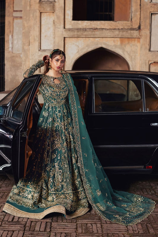 Model wearing Qalamkaar Shadmani Luxury Formals '24 Hala SH - 06 dress in deep teal with intricate gold embellishments. Shop Pakistani bridal dresses online in the UK now.