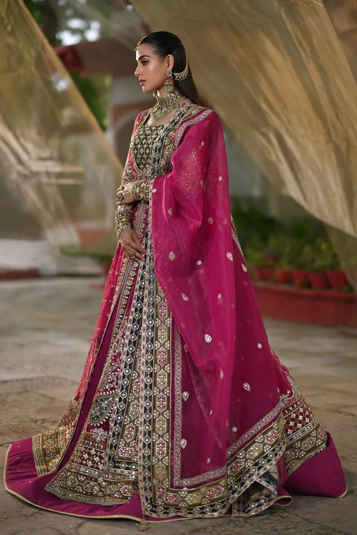 Model wearing Qalamkar Singhar Wedding Formals RF - 04 RIMEL dress in magenta, Pakistani wedding clothes online in UK.