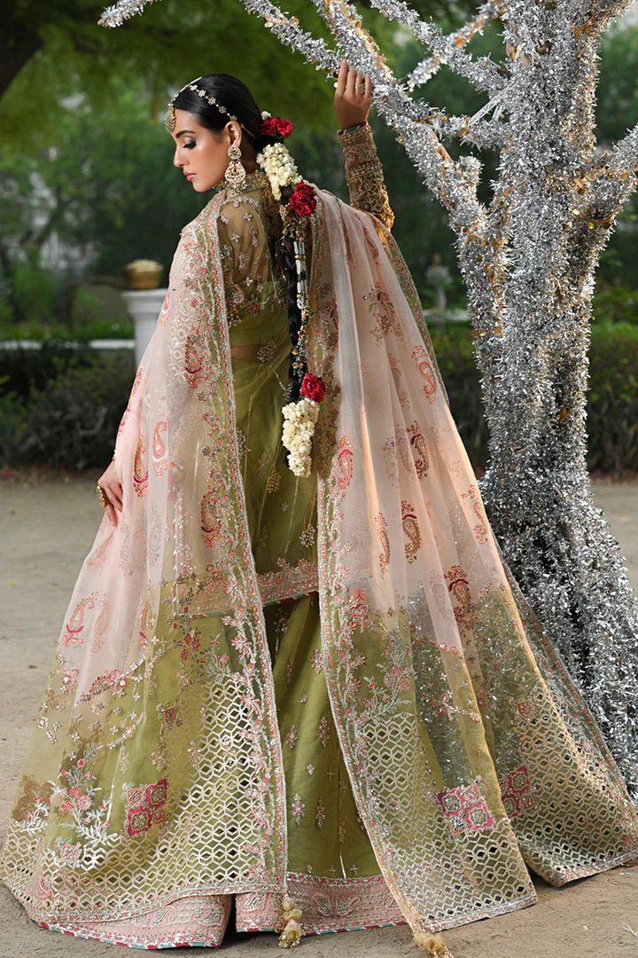 Model wearing Qalamkar Singhar Wedding Formals RF - 07 HALENA dress in olive green and peach, Pakistani wedding clothes online in UK.