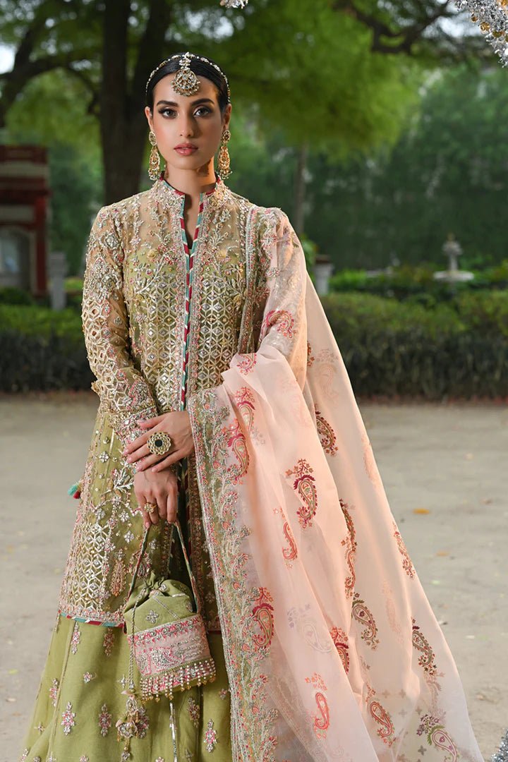 Model wearing Qalamkar Singhar Wedding Formals RF - 07 HALENA dress in olive green and peach, Pakistani wedding clothes online in UK.