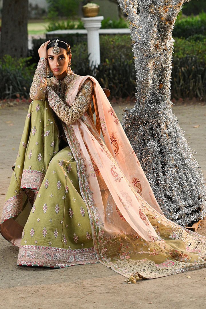 Model wearing Qalamkar Singhar Wedding Formals RF - 07 HALENA dress in olive green and peach, Pakistani wedding clothes online in UK.