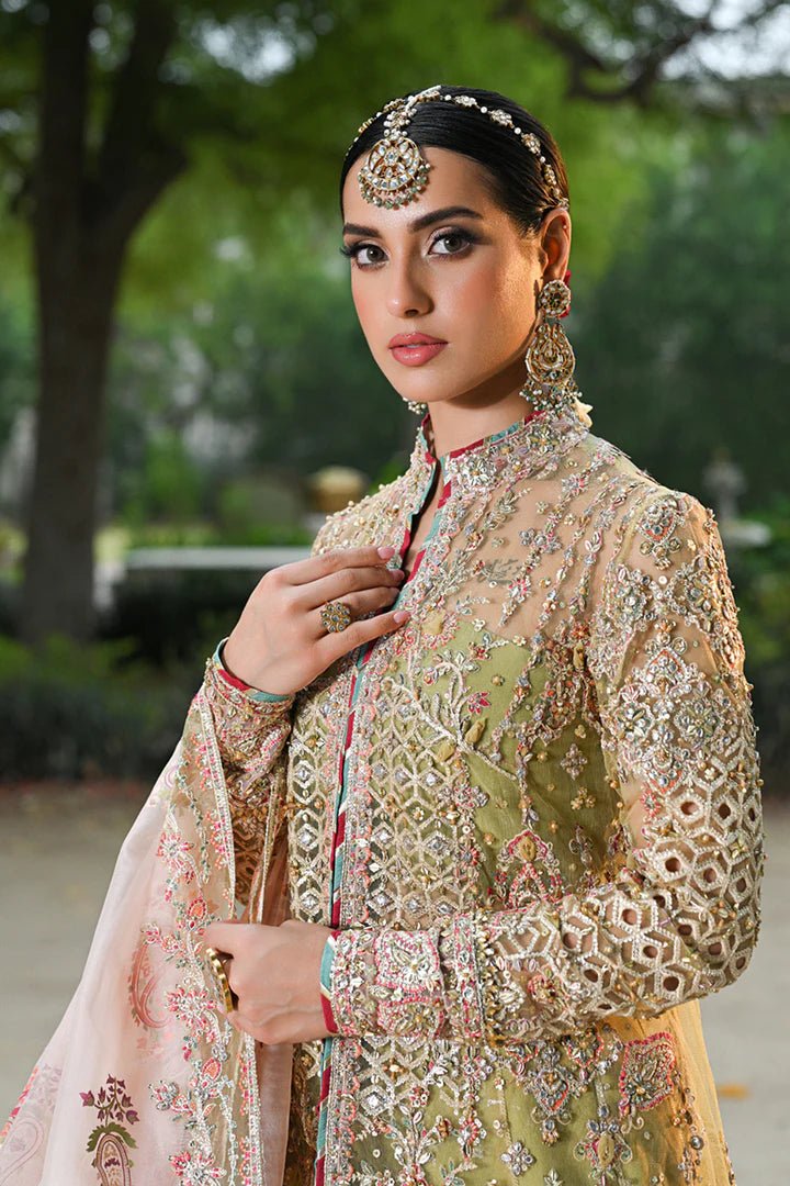 Model wearing Qalamkar Singhar Wedding Formals RF - 07 HALENA dress in olive green and peach, Pakistani wedding clothes online in UK.