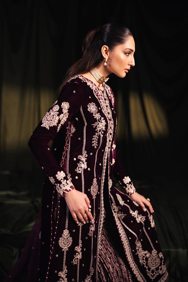 Model wearing Qalamkar Velvet Edit '24 BK - 01 AMANI, a rich maroon velvet dress with intricate embroidery, ideal for weddings. Available as Pakistani clothes online in the UK.