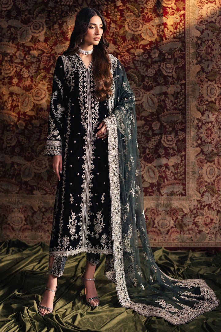 Model wearing Qalamkar Velvet Edit '24 BK - 03 SAMIRA, an elegant black velvet dress with intricate silver embroidery, ideal for weddings. Available as Pakistani clothes online in the UK.