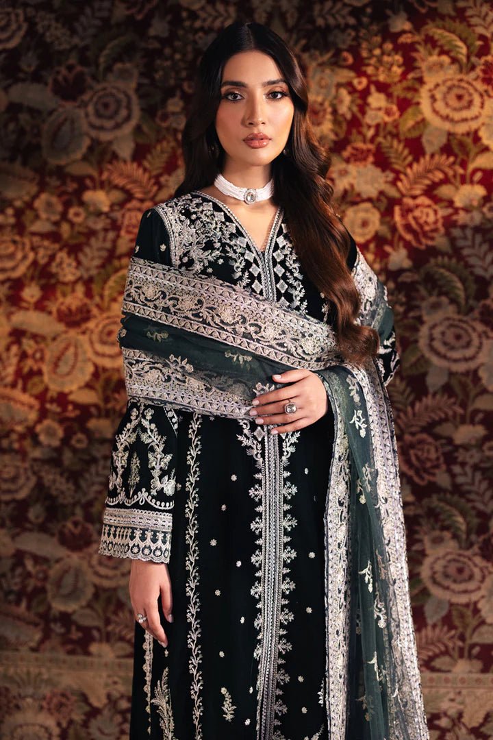 Model wearing Qalamkar Velvet Edit '24 BK - 03 SAMIRA, an elegant black velvet dress with intricate silver embroidery, ideal for weddings. Available as Pakistani clothes online in the UK.