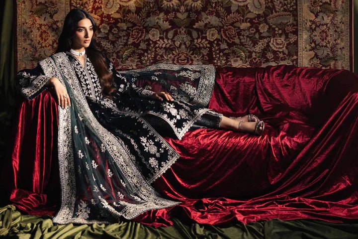 Model wearing Qalamkar Velvet Edit '24 BK - 03 SAMIRA, an elegant black velvet dress with intricate silver embroidery, ideal for weddings. Available as Pakistani clothes online in the UK.