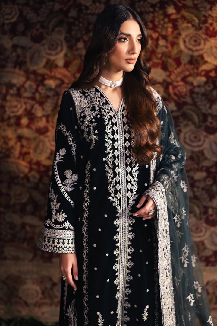 Model wearing Qalamkar Velvet Edit '24 BK - 03 SAMIRA, an elegant black velvet dress with intricate silver embroidery, ideal for weddings. Available as Pakistani clothes online in the UK.