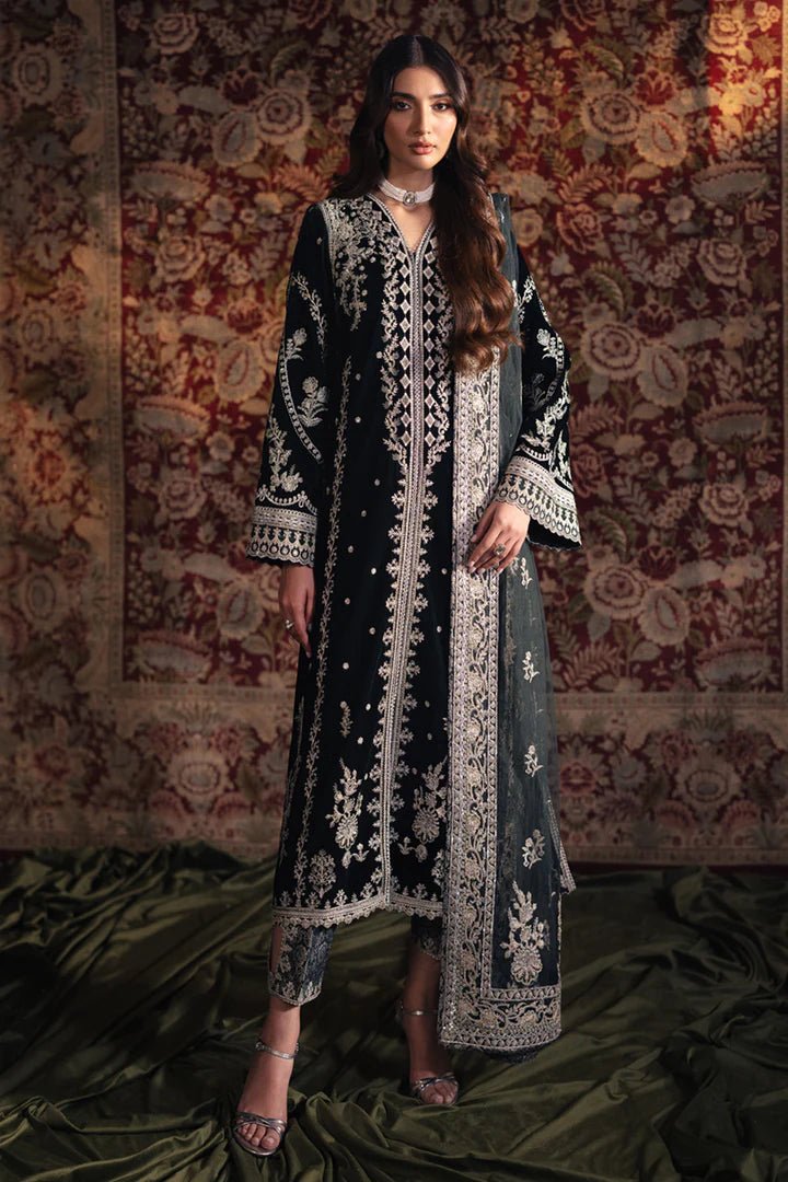 Model wearing Qalamkar Velvet Edit '24 BK - 03 SAMIRA, an elegant black velvet dress with intricate silver embroidery, ideal for weddings. Available as Pakistani clothes online in the UK.